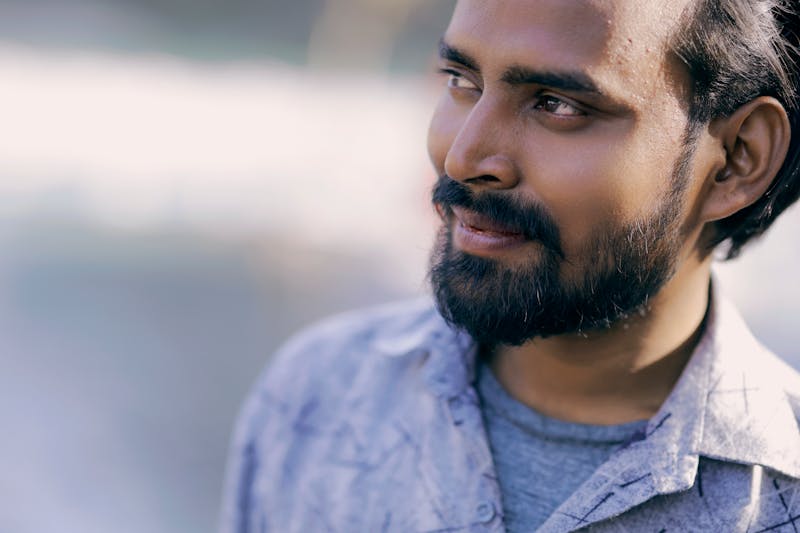 Skilled head chef preparing authentic pizza